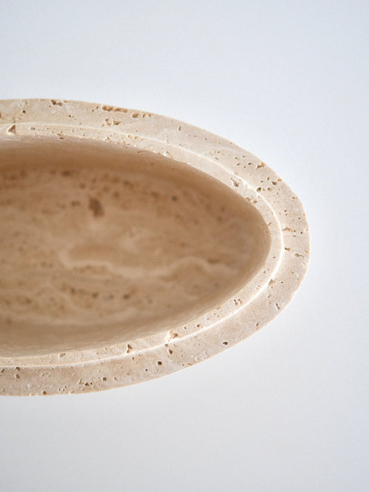 A detailed close-up of the Zeina Bowl’s inner rim, showcasing the stone’s natural porous characteristics and precision-cut contours.