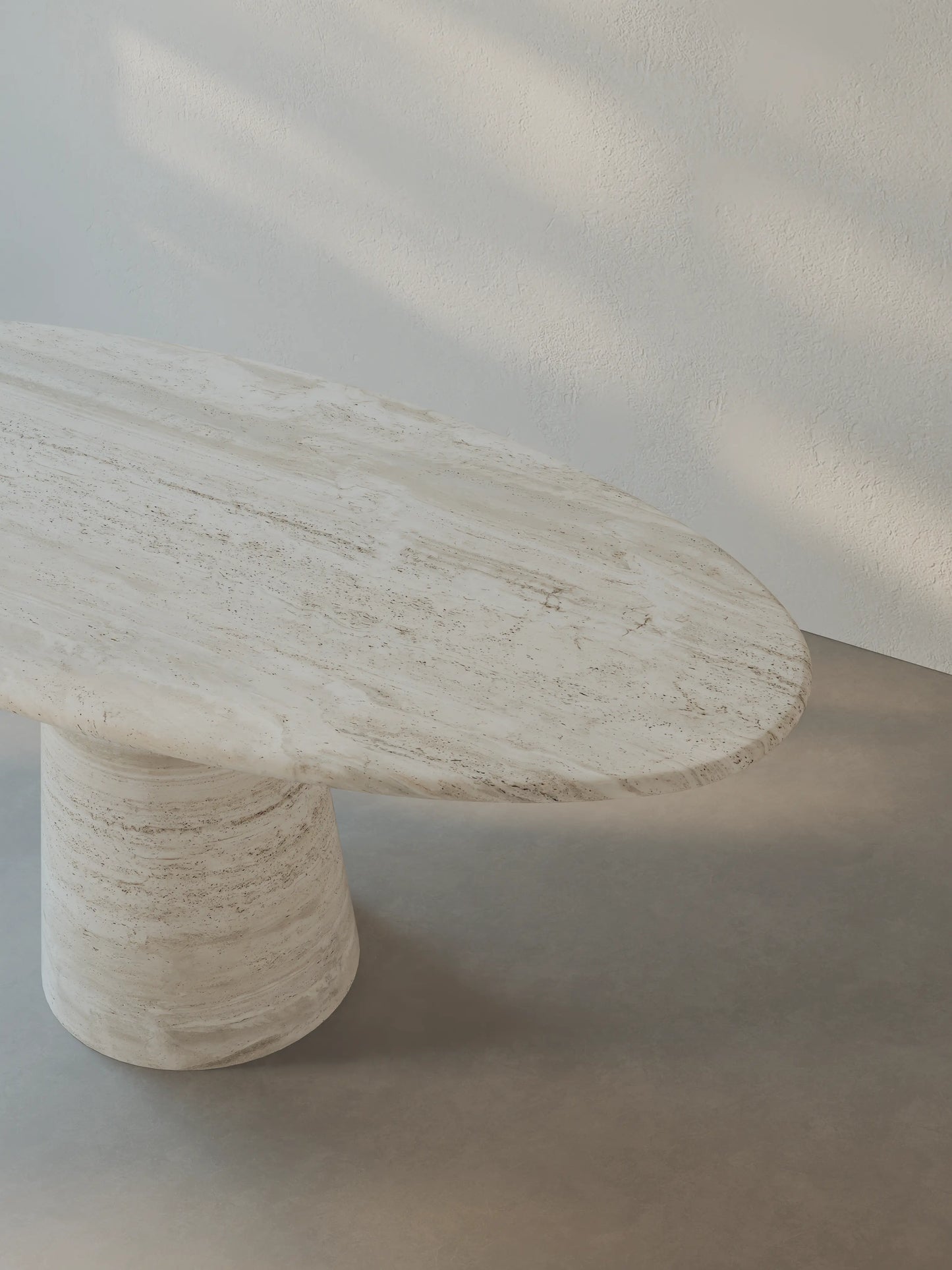 Close-up of the Leila Table tabletop in Roman travertine showing natural texture