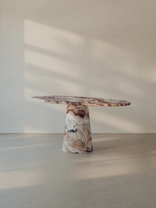 Leila Table crafted from Rosso Orobico marble, shown from a side angle
