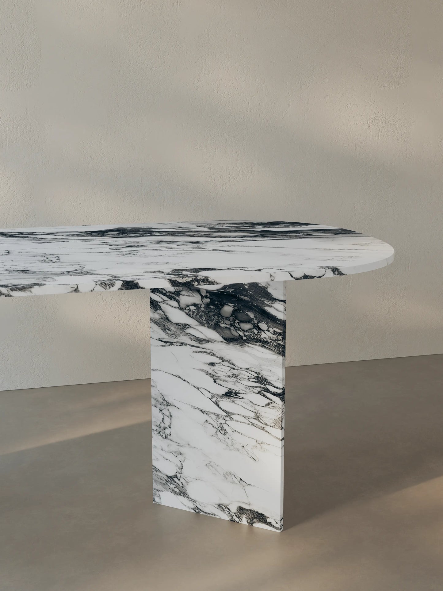 Sienae Dining Table in Arabescato Corchia marble highlighting sculptural V-shaped base and natural stone veining