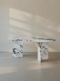 Sienae Dining Table in Arabescato Corchia marble showing oval-edged tabletop, softened edges and V-shaped base