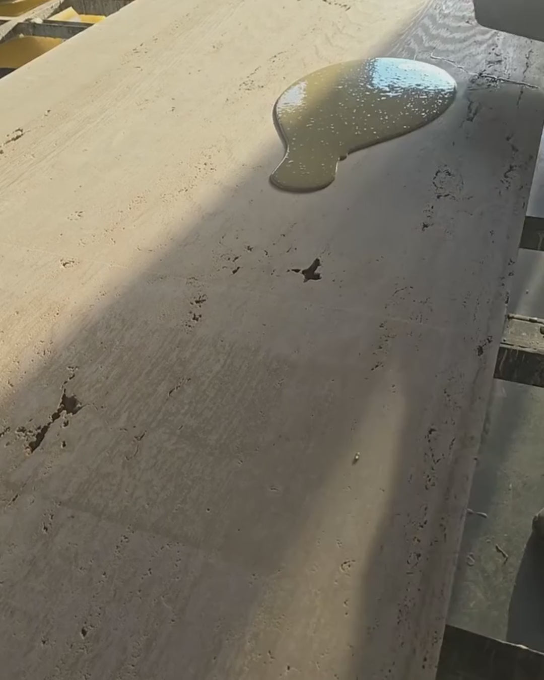 Travertine tabletop pores being filled