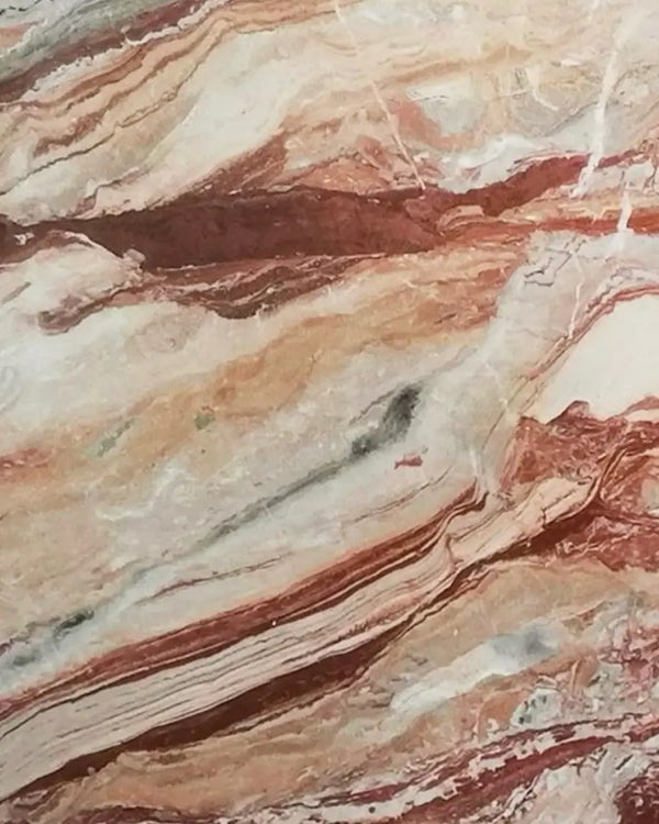 Rosso Orobico marble with deep red tones and dynamic, layered veining