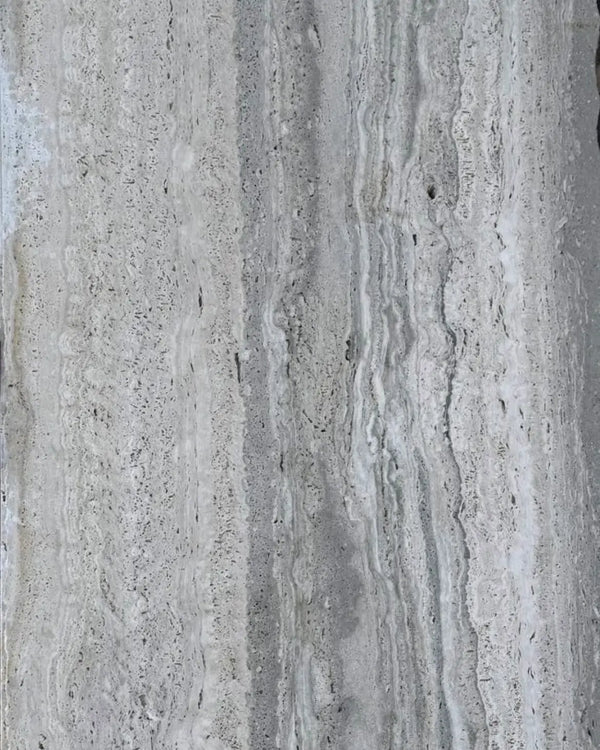 Silver Travertine surface with cool gray tones and natural linear banding